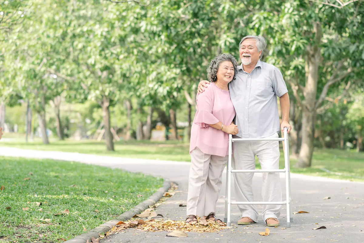 Older couple walking in a park